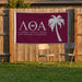 Lambda Theta Alpha Flags and Banners — on a backyard fence