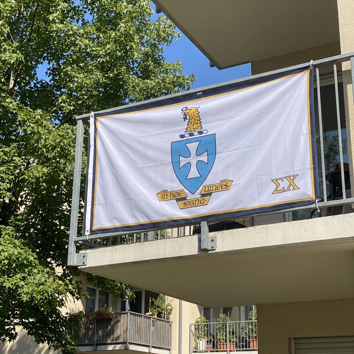 Sigma Chi Flags and Banners — hanging on an apartment balcony