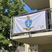 Sigma Chi Flags and Banners — hanging on an apartment balcony
