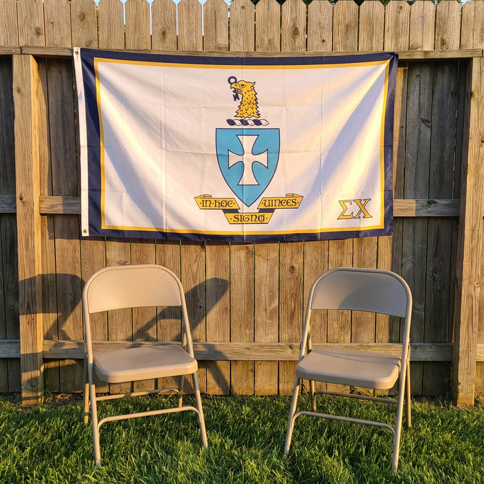 Sigma Chi Flags and Banners — on a backyard fence